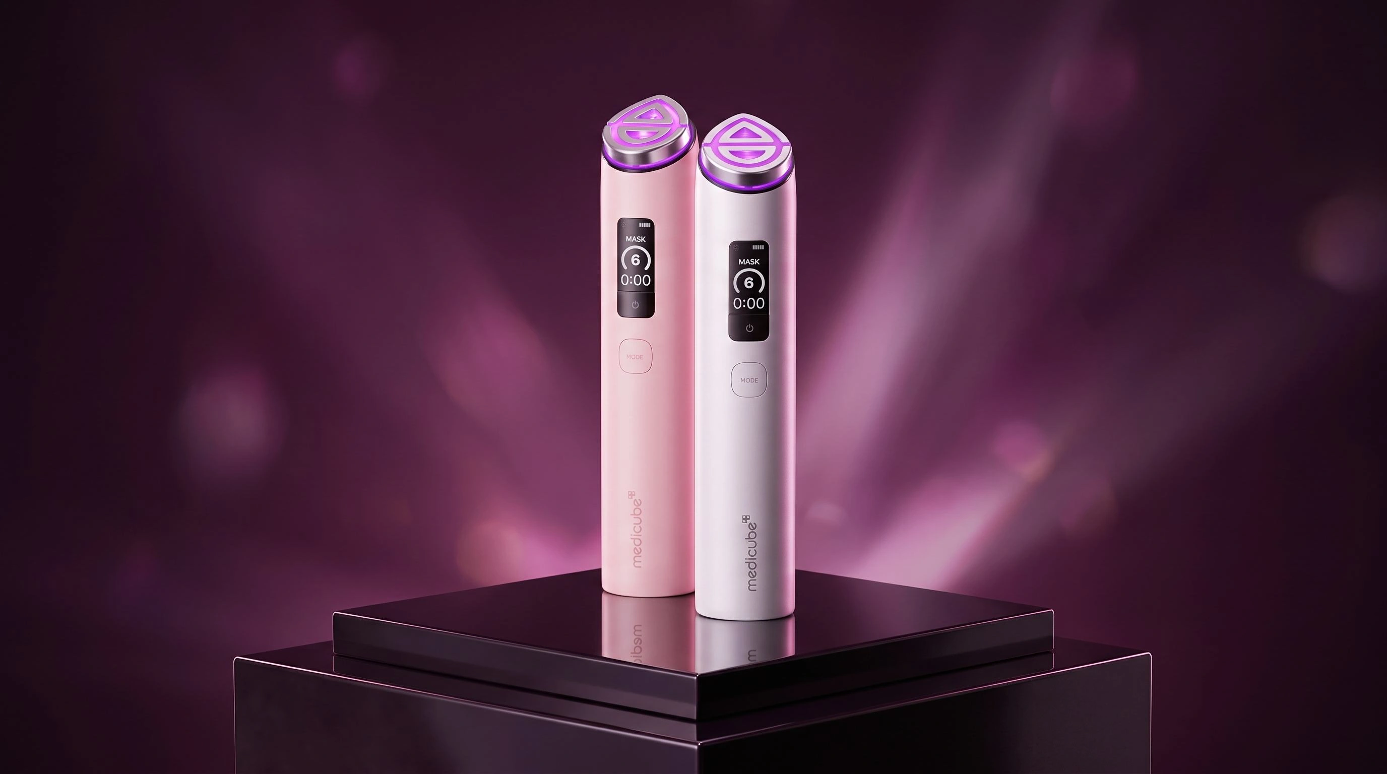 Booster Pro X2 on a dark background with pink lighting